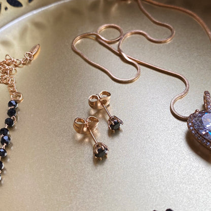 Gold-plated stud earrings with black crystal